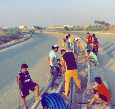 شباب من حلة غوان بصبيا يقومون بتنظيف وتشجير حزام القرية