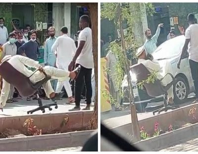 مقيم في حالة غير طبيعية يجلس على كرسي وسط الشارع في الرياض